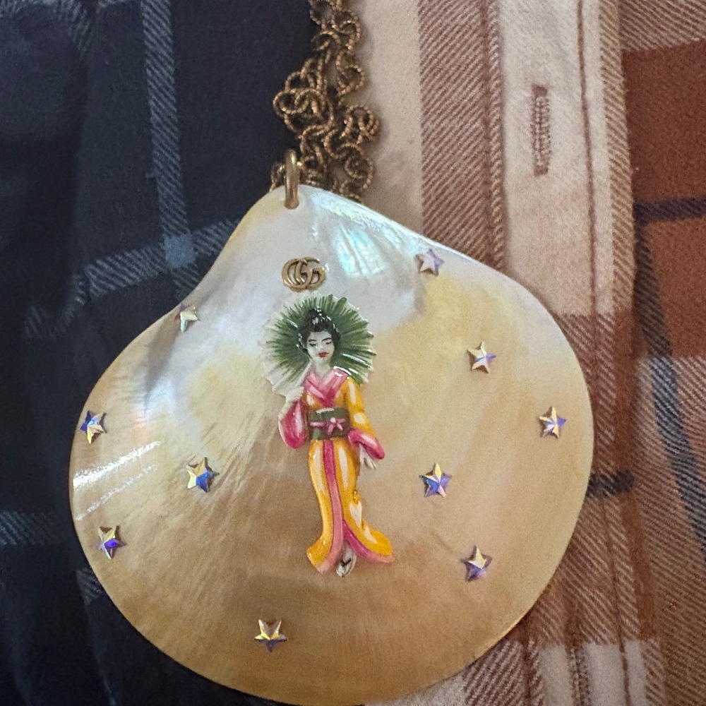 Gucci Aged Gold Tone Mother of Pearl Shell Geisha Pendant Necklace